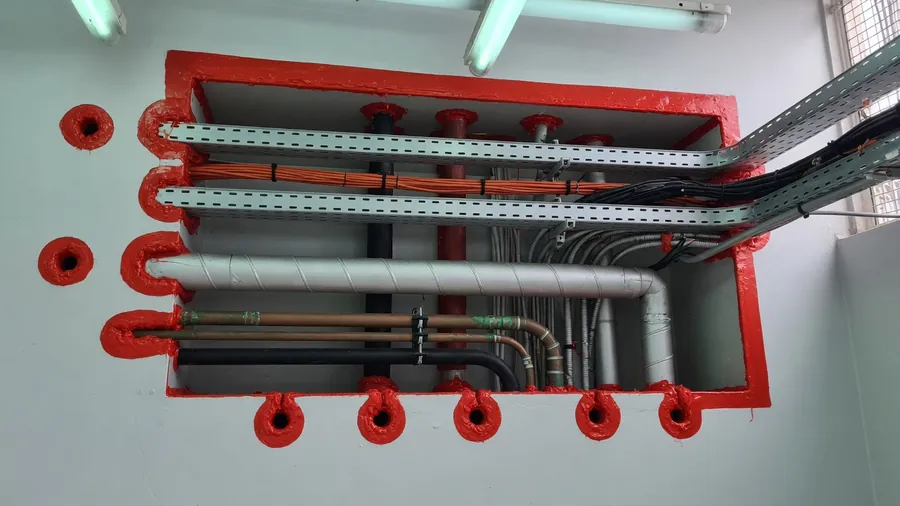 Fire-stopped service penetrations in a hospital riser